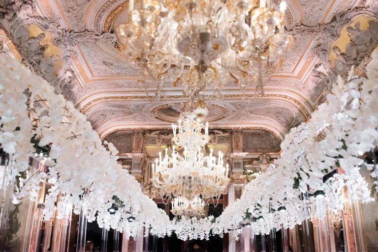 The Hall of Mirrors at Aman Venice dressed with garlands of white orchids for Phoebe and Peder's dinner, Whitesfilm Wedding Videography