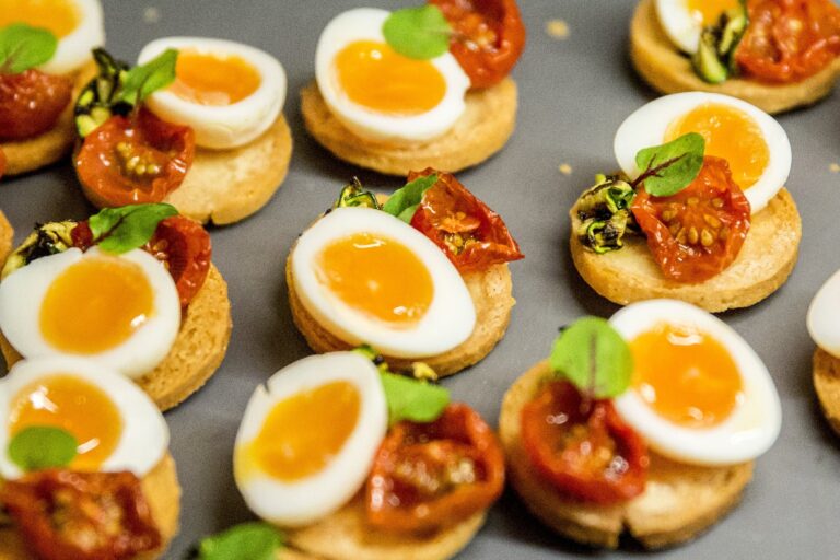 Canapes of quail egg and roasted tomato on shortbread rounds, Wickham House
