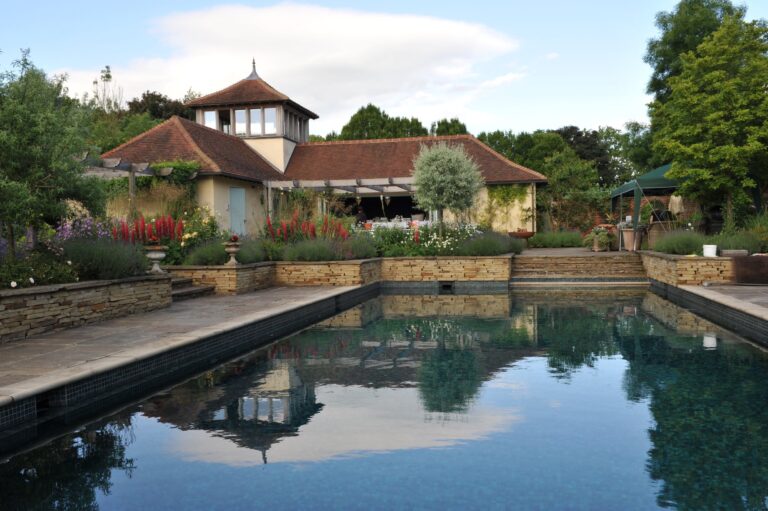 The swimming pool in the walled garden, with the Pavilion and its cupola behind, Wickham House