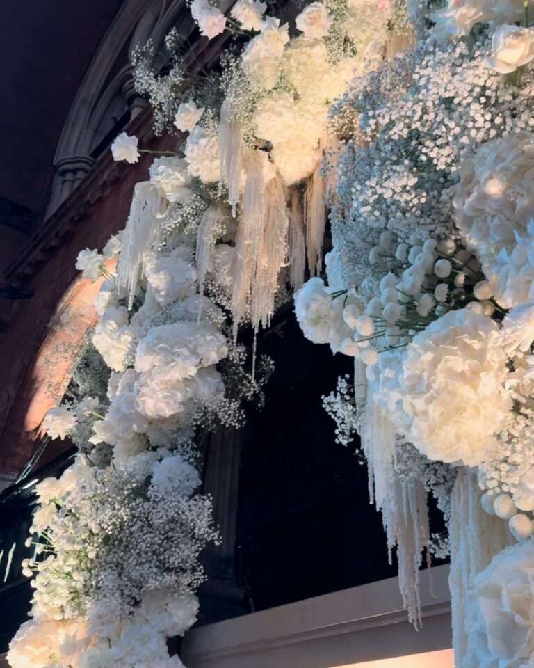 The top of the floral arch, dressed in white, The Londoner, Wildabout