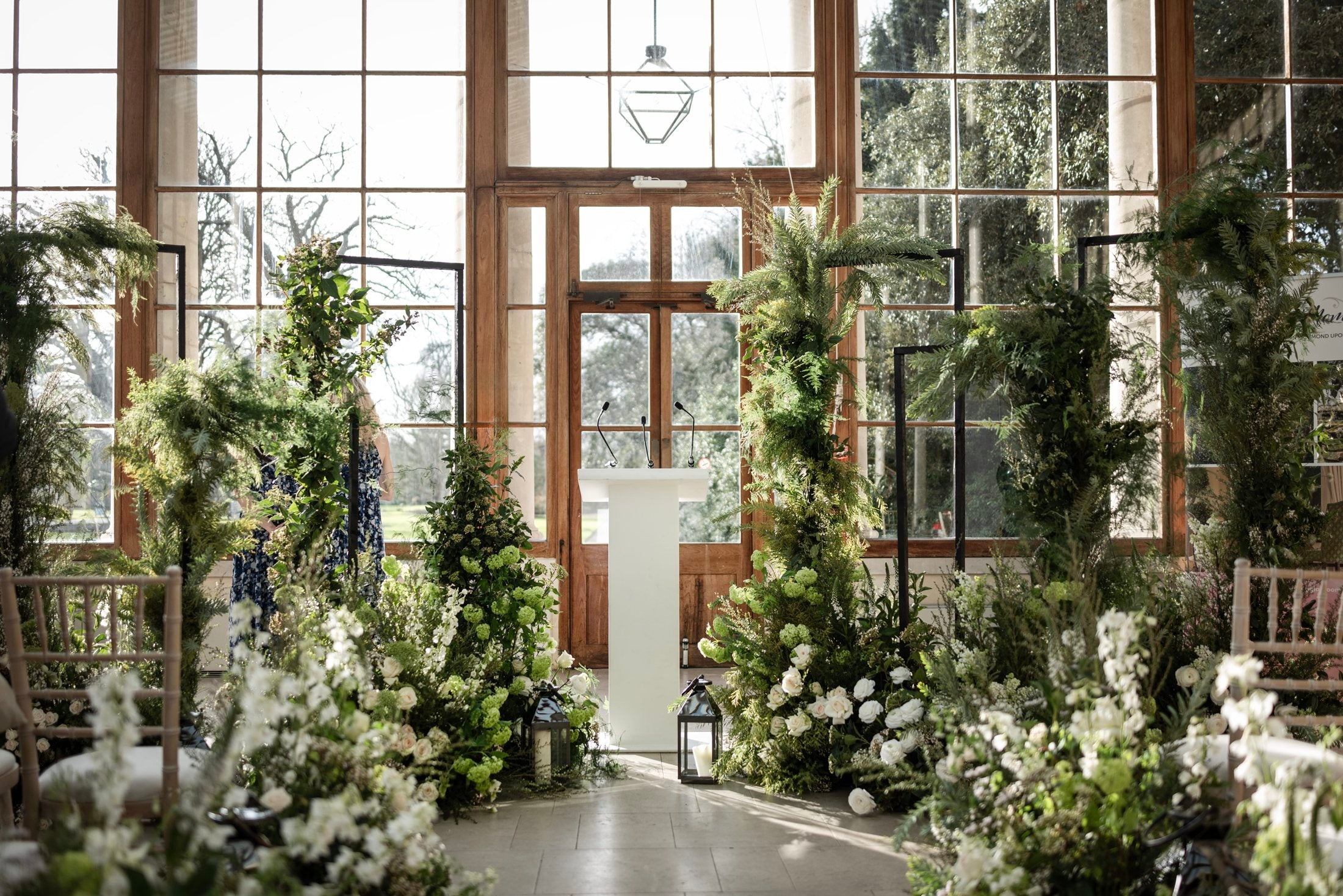 A pared-back white and green showcase aisle, Kew Gardens, Wildabout