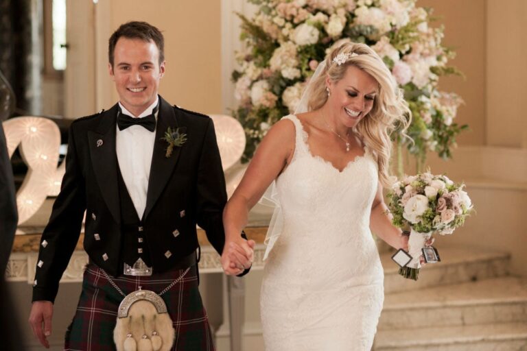 A groom in Highland dress and his bride, a real wedding, Wildabout