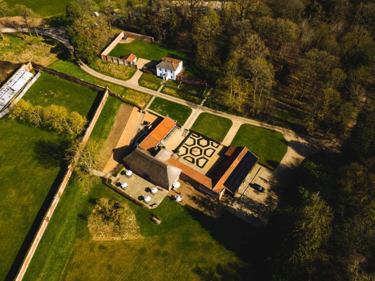 Overhead view of The Woodyard and its courtyard knot garden, with the terrace, the walled gardens and Estate Cottage at the top of the frame, Worstead Estate