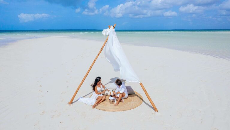 A shaded setting for two on the sand bank at low tide, Ycona Luxury Resort