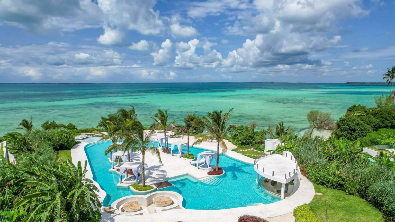 The beach and pool lounge above the turquoise Indian Ocean