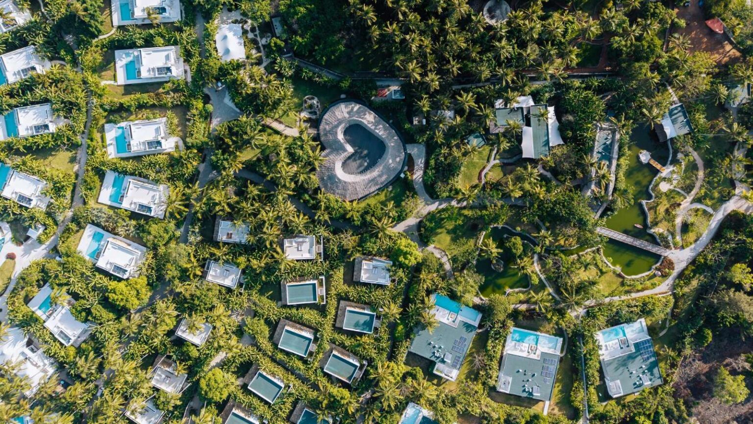 The resort from above, with the heart-shaped restaurant among the villas