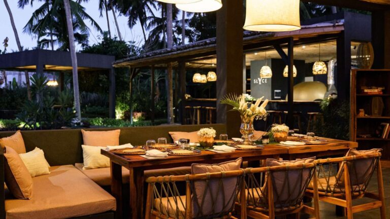 Restaurant dining room with a long communal table, Ycona Luxury Resort