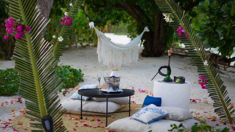 Private beach setting with cushions, hammock and lanterns, Ycona Luxury Resort