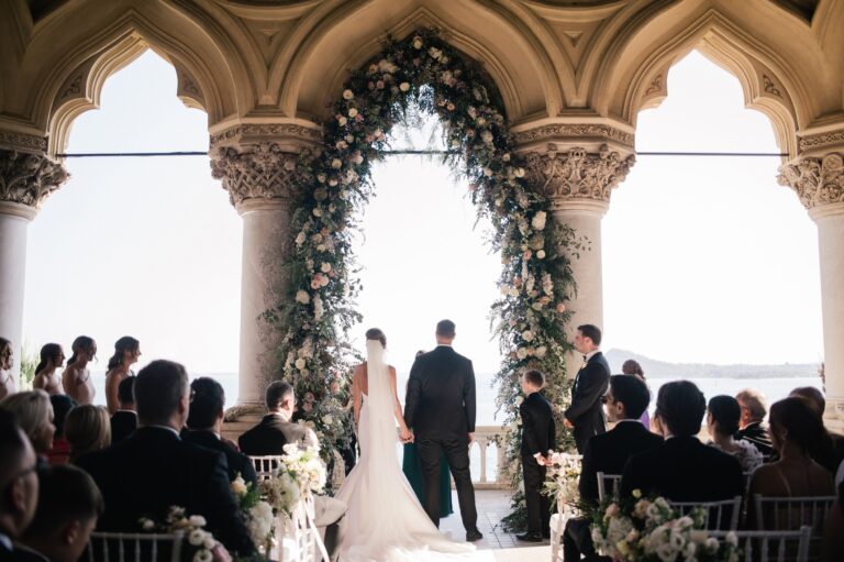 A kiss on the bow of a wooden boat, Isola del Garda's neo-Gothic villa rising behind, Lake Garda, Your Secret Tuscany