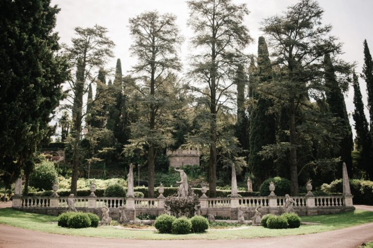 A formal Italianate garden at Isola del Garda, balustrades and classical statuary among cypress and pine, Your Secret Tuscany