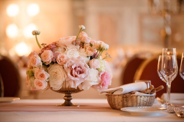 A rose centrepiece in a gold urn on a set table at Grand Hotel Continental, Siena, Your Secret Tuscany